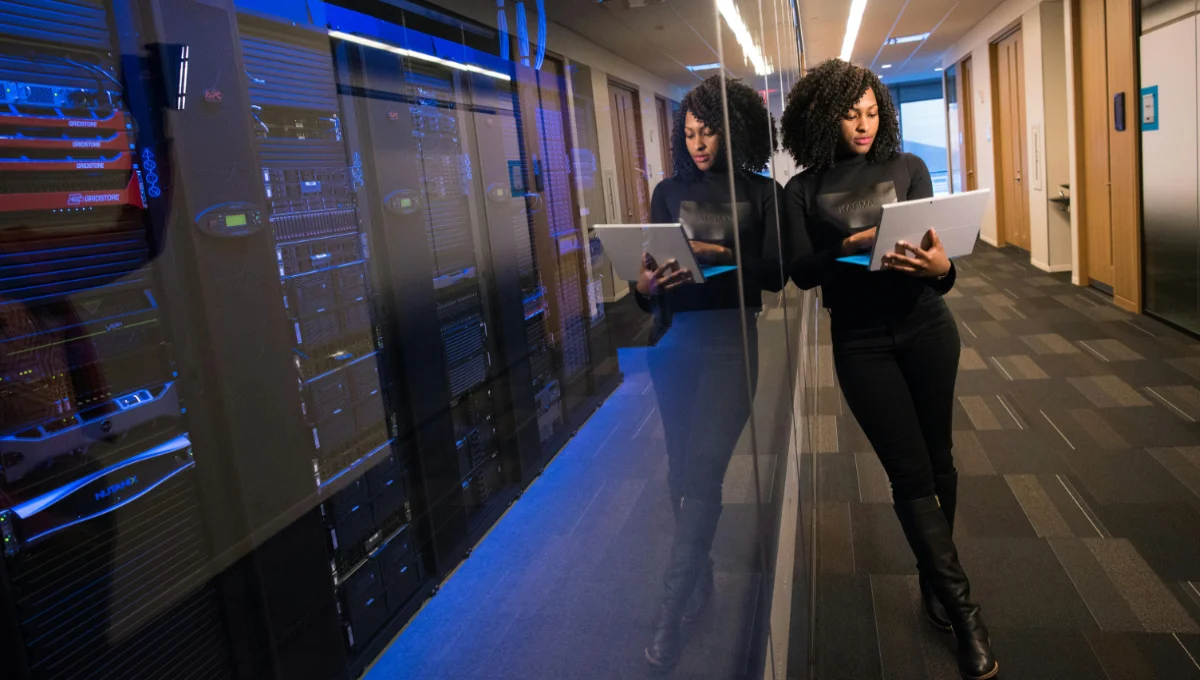 Network engineer standing in the server room with HVAC controlled environment.